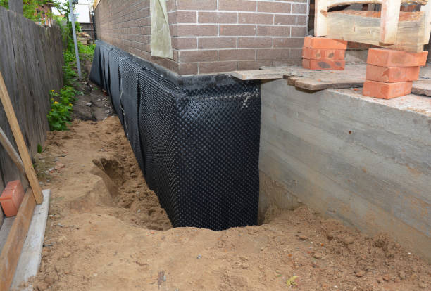 Happy homeowners after waterproofing job in Hazel Green